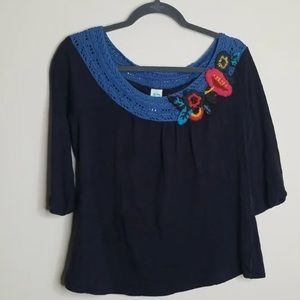 Anthropologie top with crochet yarn flowers